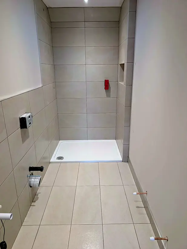 Bathroom in neutral tiles with walk in shower