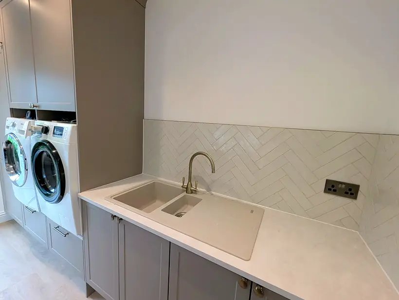 White herringbone splashback behind a sink